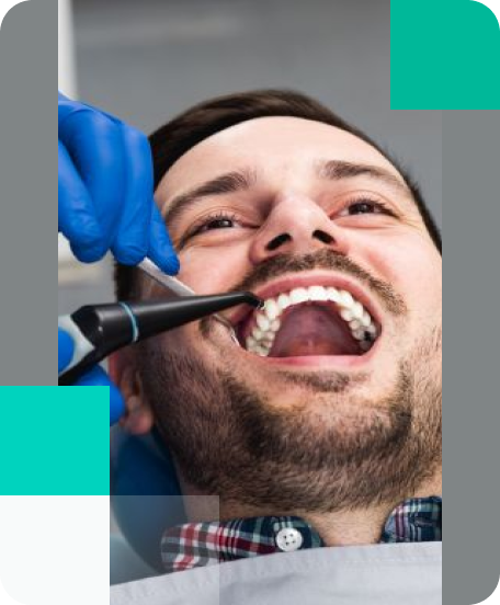 Experienced dentist performing gentle tooth extraction in Wethersfield CT dental office