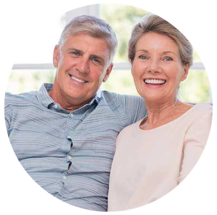 Senior couple smiling and showing healthy teeth