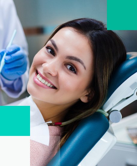 Happy patient in dental chair