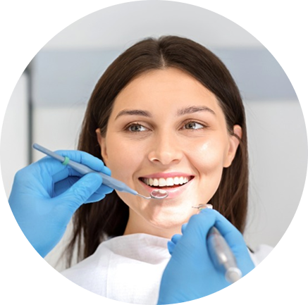 Dentist examining female patient teeth