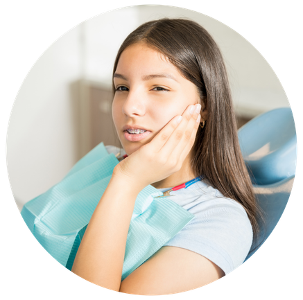 Young woman- suffering from toothache sitting on dental chair