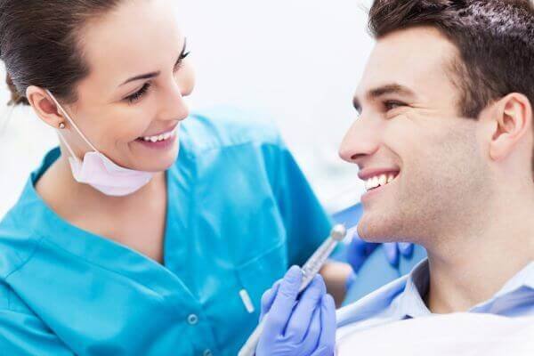 Dentist and patient smiling consultation Family Dental Center of Connecticut