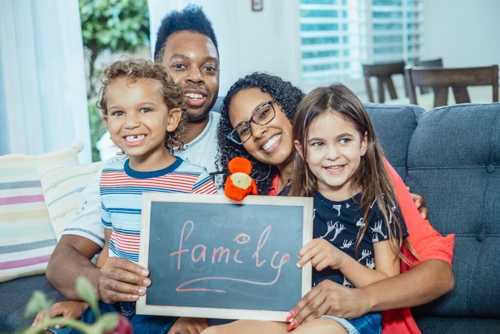 Diverse family with children smiling — all are welcome at Family Dental Center of Connecticut in Wethersfield CT