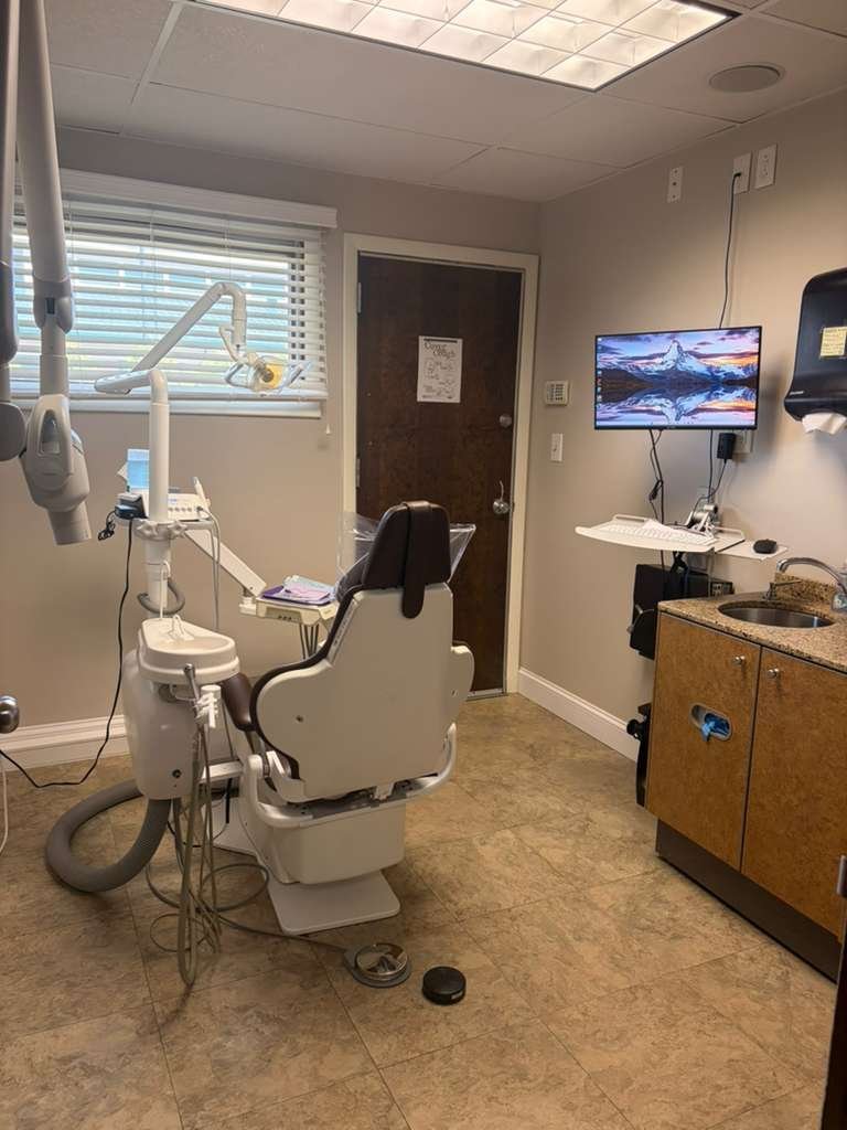 Dental chair and chairside monitor in a Wethersfield treatment room